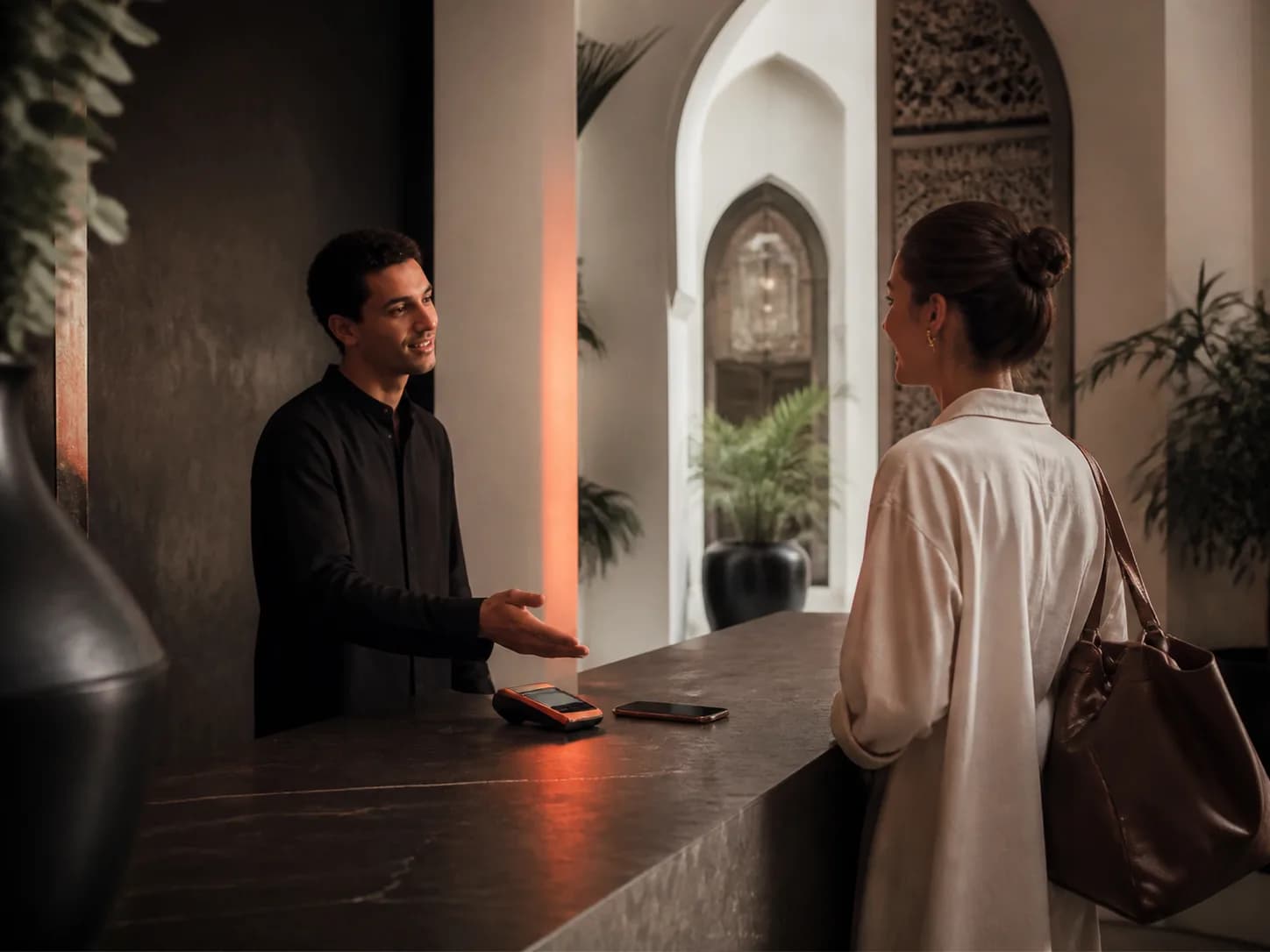 A guest completing a payment at a hotel
